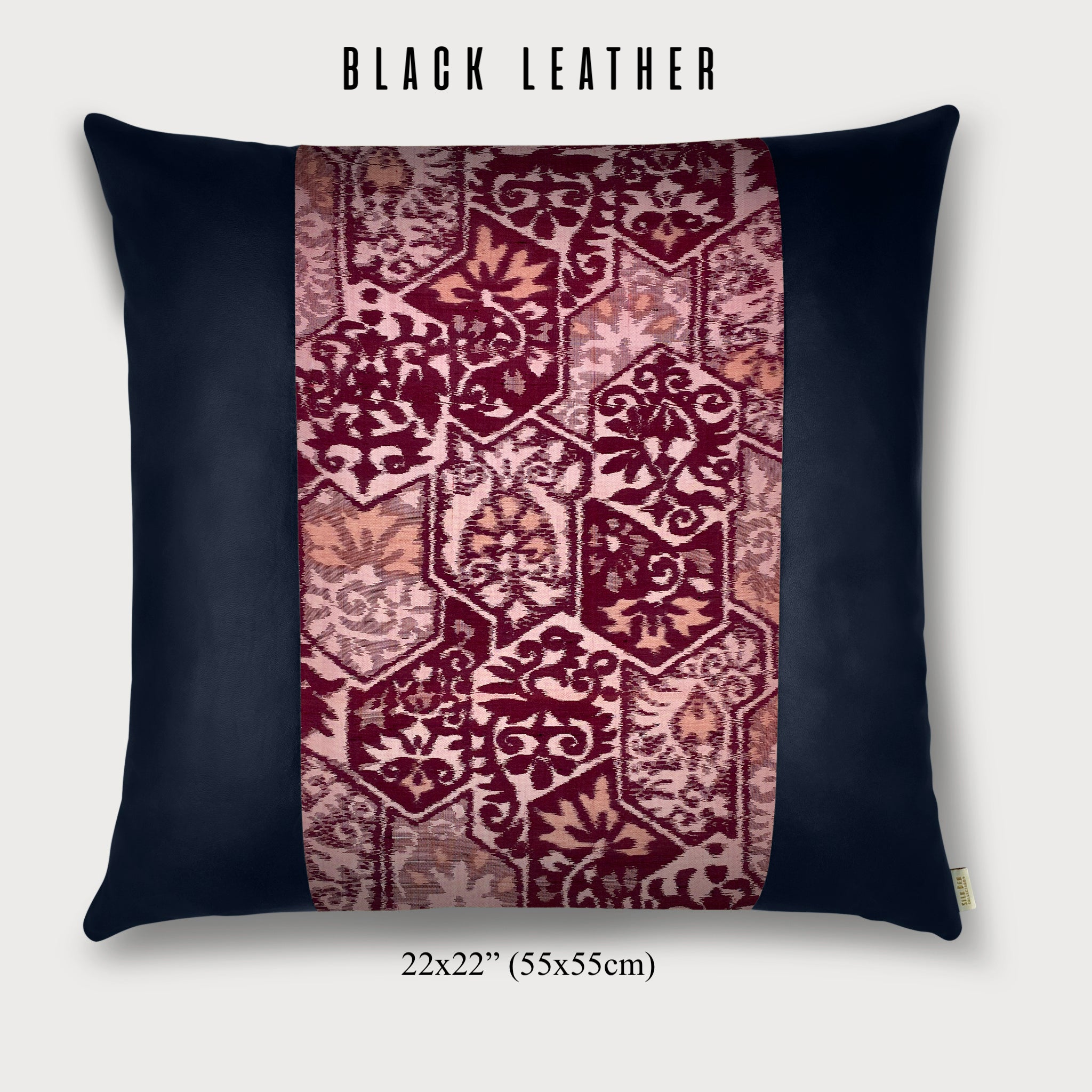 black leather throw pillow with pink silk