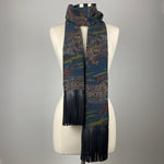 A dark blue kimono silk scarf with black leather fringe. Silk has scenery of people on a journey