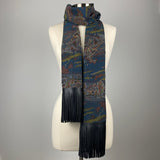 A dark blue kimono silk scarf with black leather fringe. Silk has scenery of people on a journey